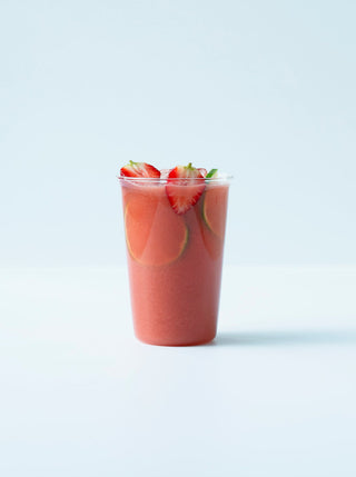 a tall glass filled with red juice topped with strawberries /blogs/recipes/active-recovery