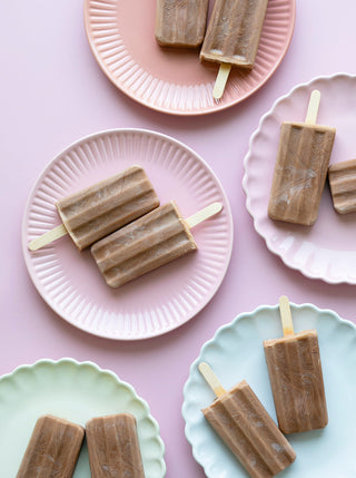 Cacao And Peanut Butter Fudgesicles  on multi colored plates