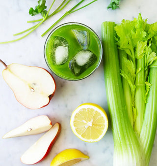 a green juice with ingredients