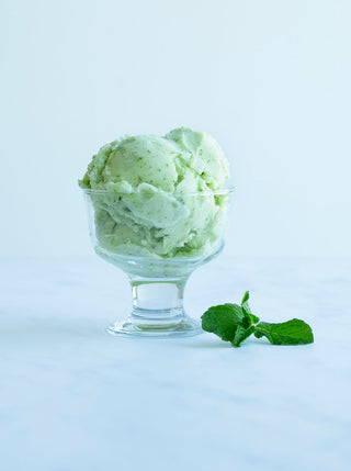 2 large scoops of Melon Mint Sorbet in a glass bowl