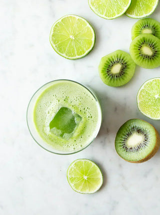 a glass of sweet cucumber cooler with lime and kiwi