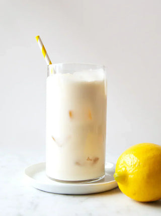 a glass of creamy cashew lemon milk