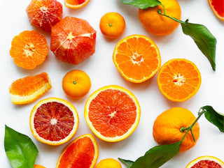 a selection of orange citrus on a white background