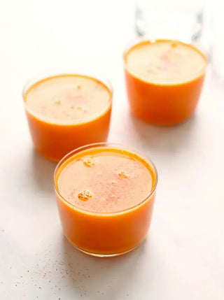 3 glasses of bright orange golden root immunity juice
