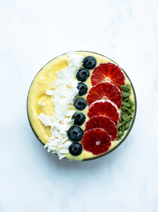 a gloden wellness bowl on a marble surface