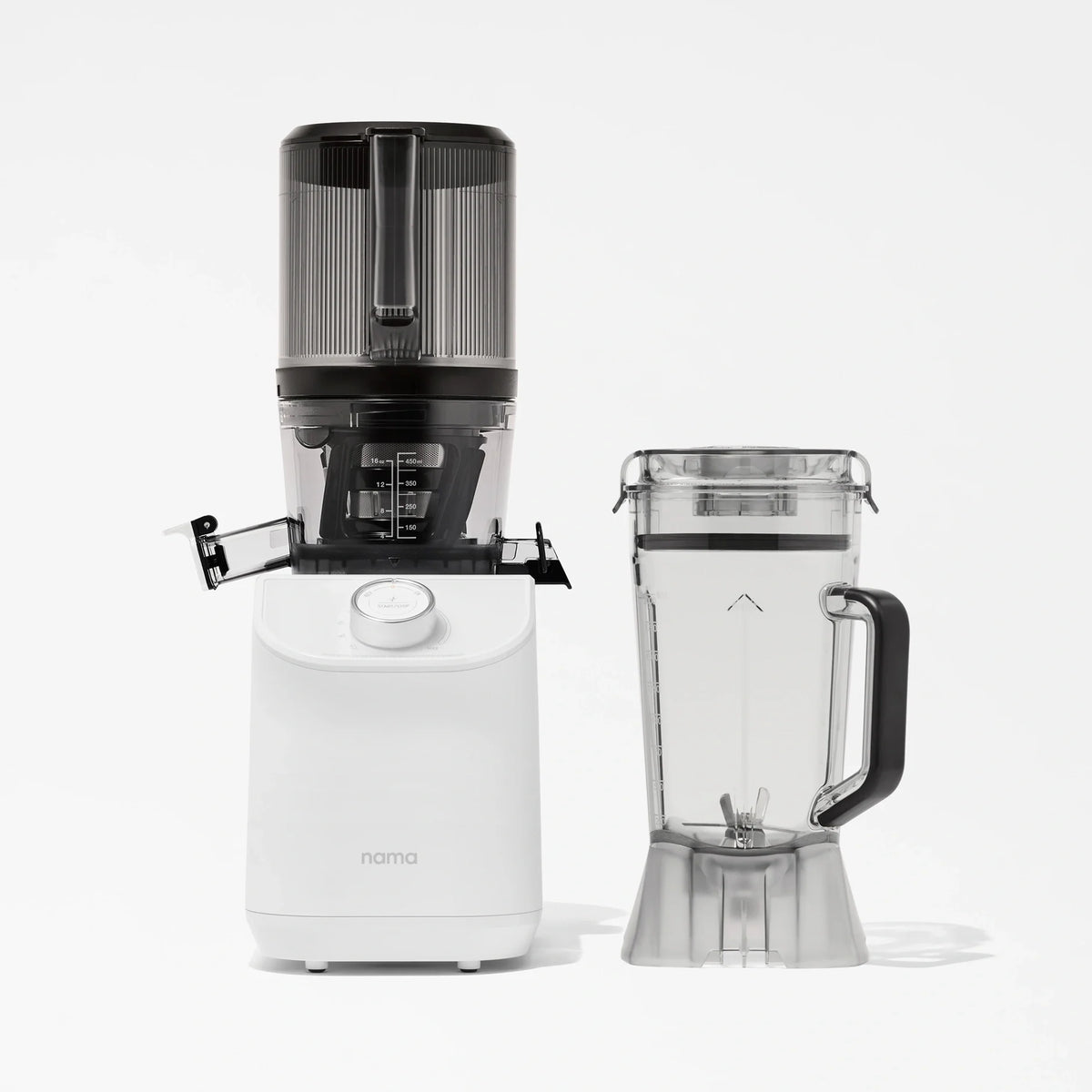 The Nama C2, a white multifunction juicer with a transparent top, is displayed next to its separate clear blender pitcher equipped with a black handle, both elegantly arranged against a plain white background.
