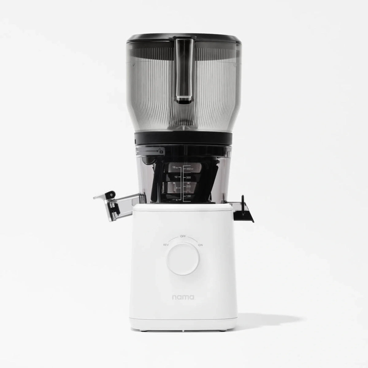A modern white Nama J2 XL Cold Press Juicer featuring a spacious transparent top container, a central dial, and a convenient spout for dispensing juice, set against a plain white background. This easy-to-clean juicer combines style and functionality for your kitchen.