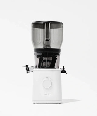 A modern, white electric juicer with a transparent upper container and black accents, shown against a plain white background. The front dial and juice spout are visible.