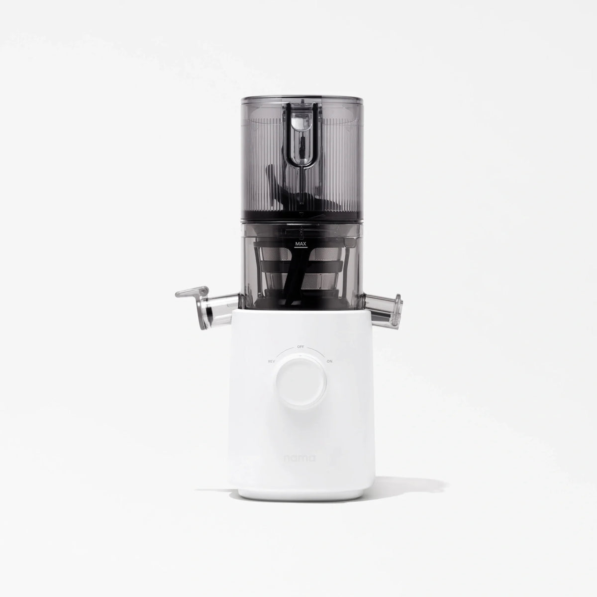 The Nama J3 is a modern cold press juicer featuring a white base, a central dial, and a transparent dark gray container on top, displayed against a plain white background.