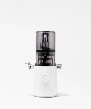 A modern white and transparent juicer with a central dial and side spouts, set against a plain white background.