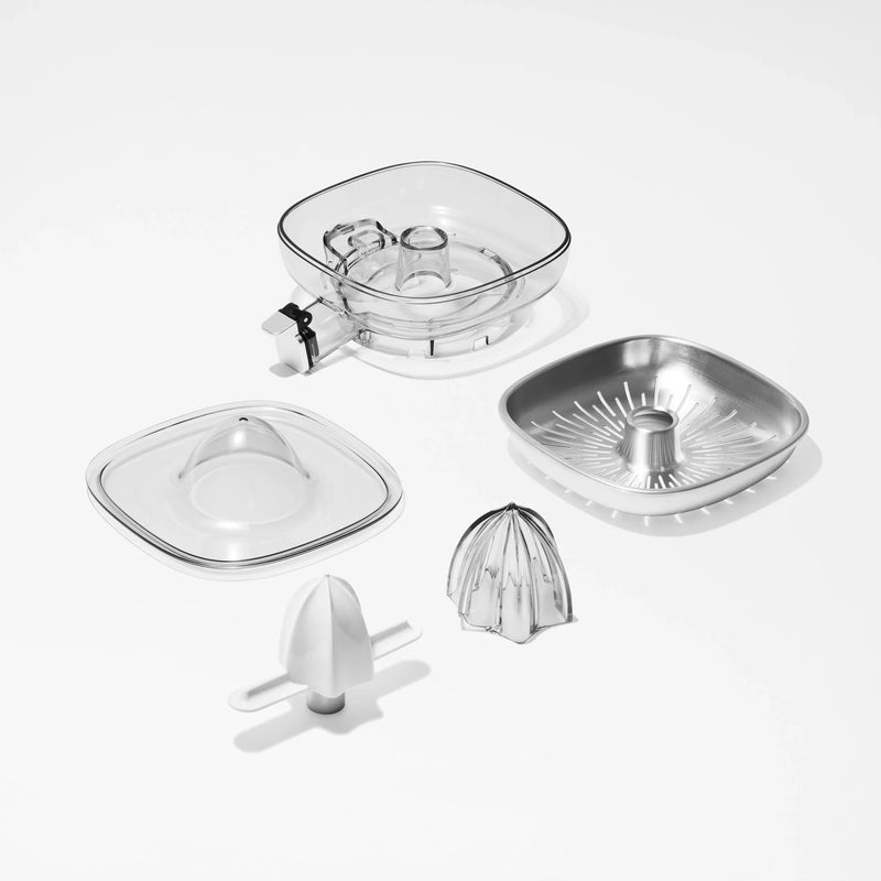 Here’s a revised version of your sentence using the given product data: The Citrus Attachment is a versatile set consisting of five separate kitchen appliance parts: plastic and metal juicer attachments, a transparent square container, a matching plastic lid, a ridged metal dish for extracting juice from citrus fruits, and two reamer inserts—all arranged on a white background.