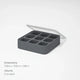 The Ice Cube Tray is a gray silicone tray featuring nine square compartments, each holding 2 oz. It comes with a clear lid that’s partially open, and dimensions of 7.09 x 7.09 x 1.96 inches are displayed on a white background.