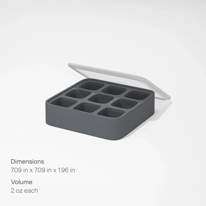 The Ice Cube Tray is a gray silicone tray featuring nine square compartments, each holding 2 oz. It comes with a clear lid that’s partially open, and dimensions of 7.09 x 7.09 x 1.96 inches are displayed on a white background.
