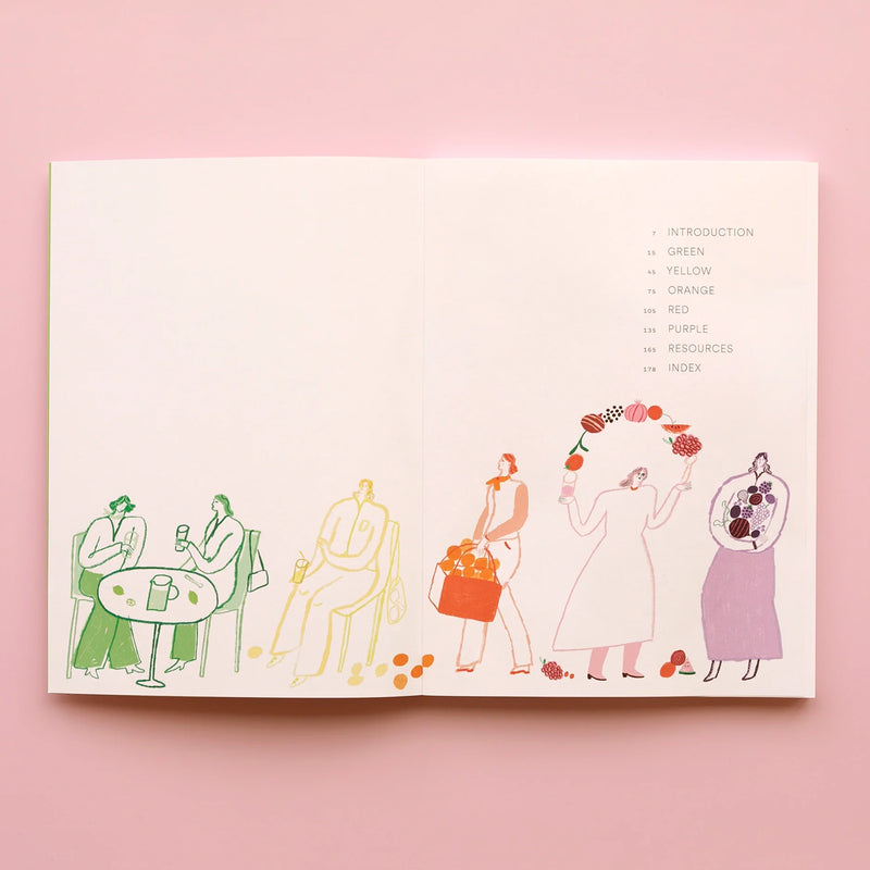 An open copy of the “Juice the Rainbow Book” rests on a pink surface, displaying a vibrant table of contents adorned with abstract illustrations of people in shades of green, yellow, orange, red, and purple—each engaging with different fruits—to evoke the colorful world of plant-based nutrition and inspire delicious juice recipes found inside.