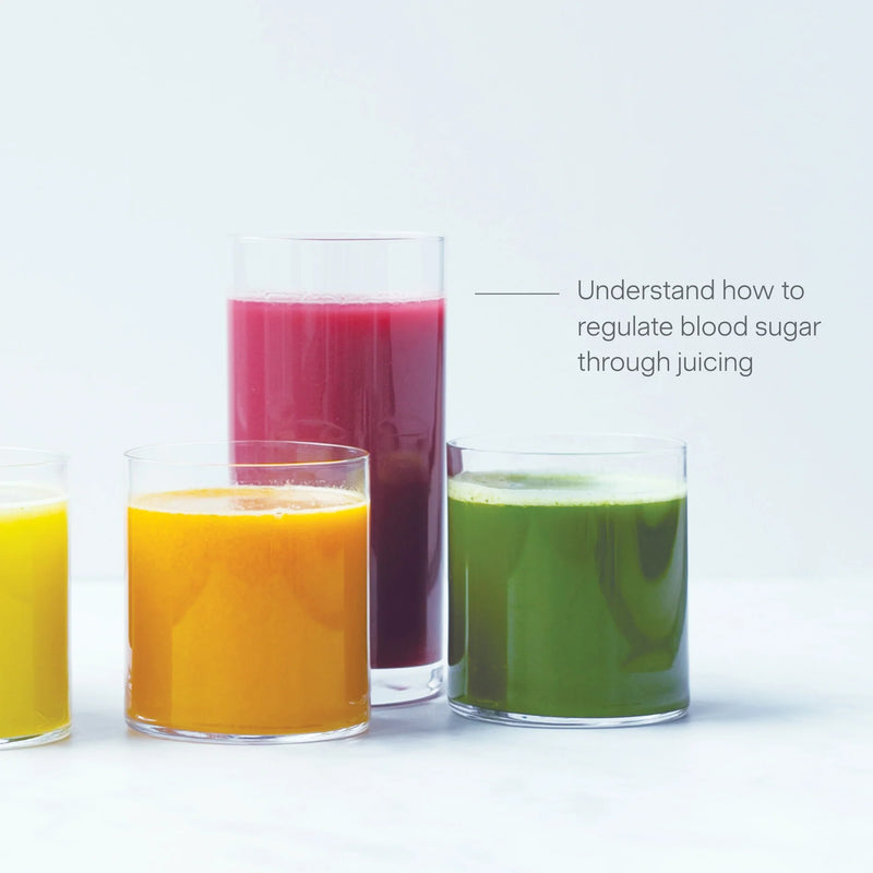 Four glasses of colorful juice—yellow, orange, green, and purple—are lined up on a white surface. Text reads, Juicing for Balanced Blood Sugar: Understand how to regulate blood sugar through juicing.