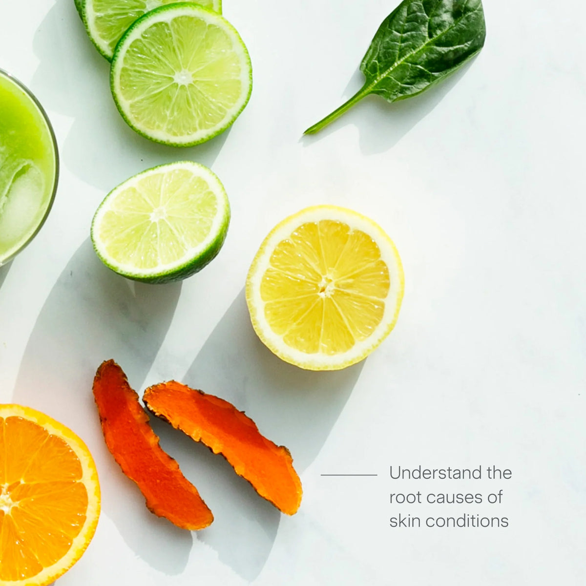 Sliced lime, lemon, and orange, with orange peels and a spinach leaf on a white surface. Text reads: Skin Health—understand the root causes of skin conditions.