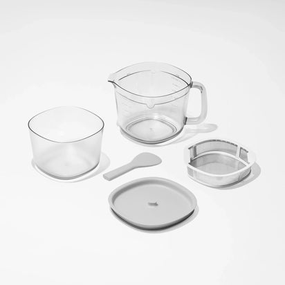 The Large Pitcher Set is displayed on a white background, featuring five kitchen items: a transparent measuring pitcher with handle and matching strainer, a clear bowl, a plastic spatula, a round lid, and a metal mesh strainer—ideal as versatile pitcher and strainer juicer accessories or for convenient juice storage.