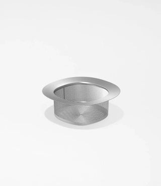 A metal mesh sink strainer with a wide rim is placed on a plain white surface.
