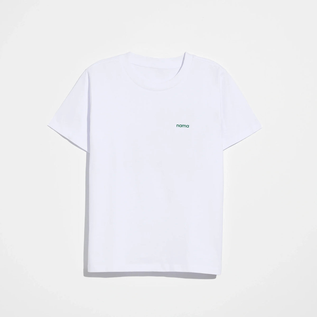 The Eat More Plants T-shirt is a relaxed fit, short-sleeve tee made from 100% combed cotton in plain white, featuring a small “nama” text logo on the left chest and displayed against a white background. Perfect for those seeking comfort and minimalist style, it’s an ideal pick for fans of the Eat More Plants T-Shirt aesthetic.