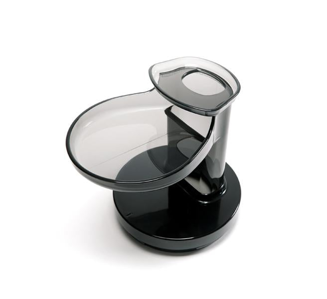 Introducing Hopper, a modern pet feeder crafted in black and clear plastic, featuring a bowl at the base and a vertical reservoir for dispensing food or water. Inspired by the sleek, elegantly rounded lines of the Nama Vitality 5800 cold press juicer lid and hopper, Hopper stands out against a crisp white background with its contemporary design.