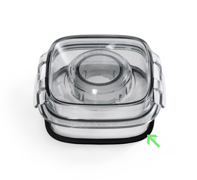 A clear square blender lid with a center opening and a green arrow highlighting the Blender Jug Lid Gasket, a black rubber gasket that ensures a secure blender seal underneath.