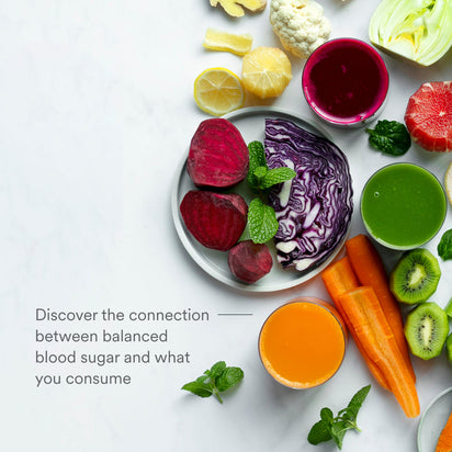 A plate with beetroot, cabbage, and mint sits among lemon, cauliflower, fennel, carrot, grapefruit, kiwi, juices, and herbs. Text: “Juicing for Balanced Blood Sugar—see how your choices impact blood sugar levels.”.