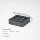 The Nama Ice Cube Tray is a black silicone tray with a clear lid, featuring nine square compartments, each holding 2 oz. Dimensions are 7.09" x 7.09" x 1.96".