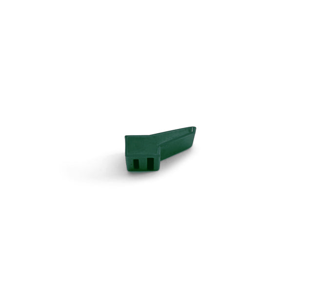 A green, plastic Pulp Outlet Gasket with a rectangular base and a tapered, angled top is shown on a white background.