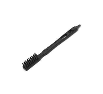 A Cleaning Brush with stiff bristles and a narrow handle is shown against a white background. The black brush is designed for detailed cleaning or maintenance tasks, making it especially useful for maintaining your Nama J2 Cold Press Juicer.