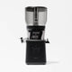 The Nama J2 XL Cold Press Juicer in black and transparent features a large top container, central spout, control knob, and side locking arms. Shown on a white background, this easy-to-clean juicer blends style with efficiency.