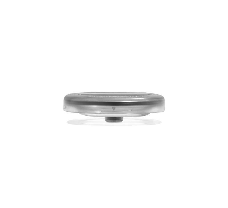 A small, round Chamber Lid in gray with a flat base and gently domed top, photographed against a white background; this accessory is designed for the Nama M1 Plant-Based Milk Maker.