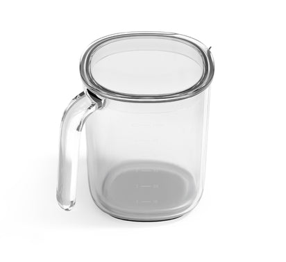 A clear glass measuring cup with a handle and markings, seen from above on a white background—ideal for pouring into your Juice and Pulp Container Set.