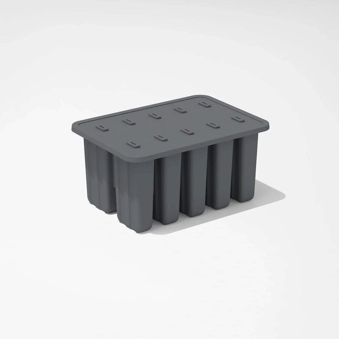 The Nama Popsicle Mold is a rectangular, dark gray silicone tray with a fitted lid and six large compartments, shown on a white background.