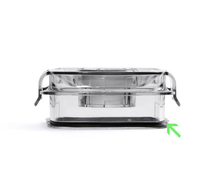 Side view of the Blender Jug Lid Gasket with a lid. A green arrow highlights a latch or tab at the bottom right corner, demonstrating a secure fit similar to how a blender lid gasket seals in place.