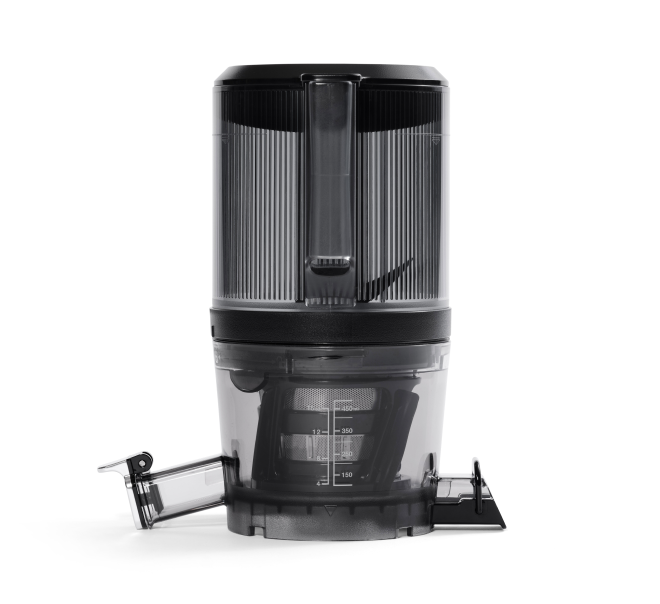 A black and transparent juice extractor, resembling the Nama C2 Cold Press Juicer, is viewed from the front with a vertical cylindrical design and detachable spouts on both sides. Measurement markings are visible on the lower container, while its Chamber Set ensures efficient juicing.