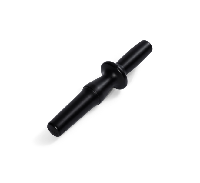 The Pusher is a black plastic blender tamper tool featuring a flared guard, displayed on a white background. Designed to efficiently push ingredients toward the blades while blending, this versatile accessory also functions as a juicer pusher—ideal for use with appliances like the Nama C2 Cold Press Juicer or in conjunction with your blender lid for hands-free operation.