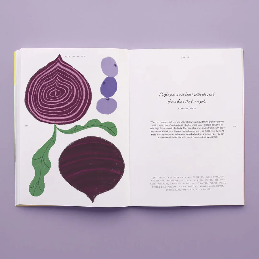 An open Juice the Rainbow recipe book displays a red onion, purple circles, and green leaves on the left page. The right page features info about purple produce, a quote, and a list of plant-based nutrition foods at the bottom.