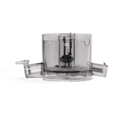 A transparent, cylindrical Chamber main compartment bowl with two side spouts and a central black attachment inside, designed for efficient juice extraction, placed against a white background.