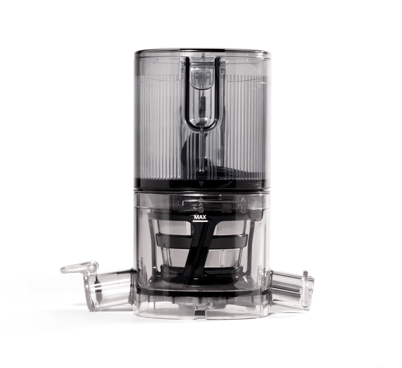 A transparent Chamber Set features a cylindrical top chamber reminiscent of the Nama J3 Cold Press Juicer, equipped with a black mesh filter inside for efficient juice extraction and two funnel-shaped spouts on either side at the base. The MAX fill line is clearly visible in the center of the chamber set.