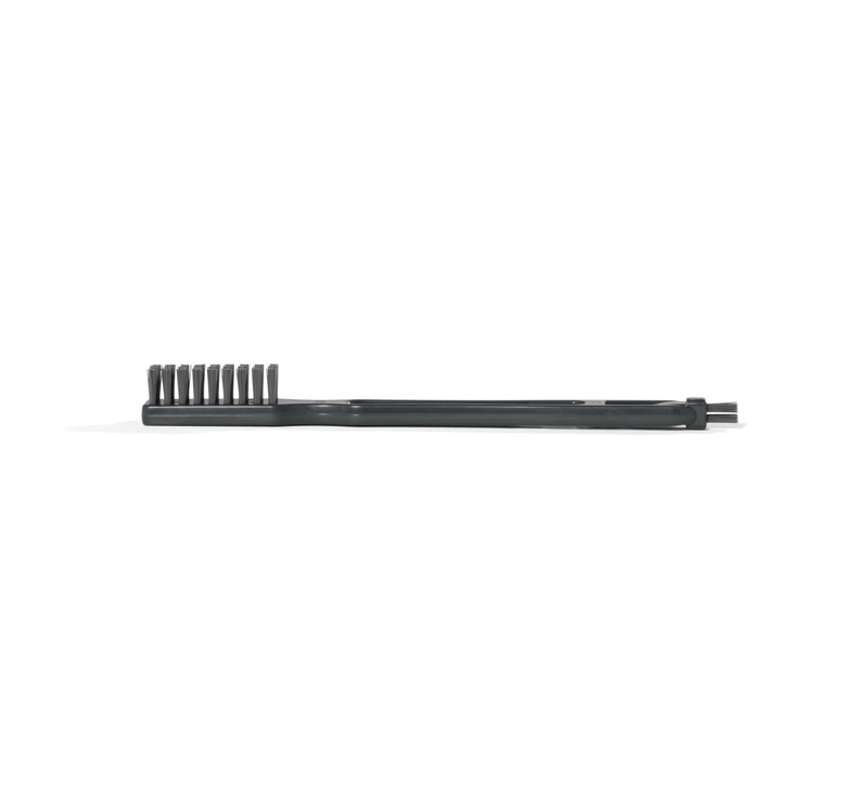 A Cleaning Brush, featuring a sleek black design, lies flat on a white background and is shown from the side. The visible bristles and minimalistic style create an elegant look, making it a refined addition to any brush collection.