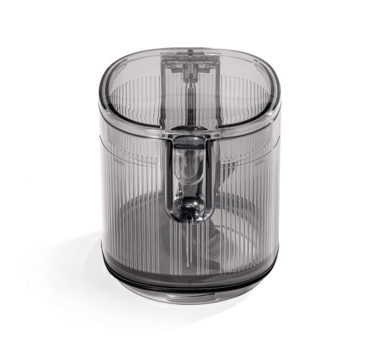 A transparent, cylindrical Hopper Assembly with a ridged surface and a visible internal mixing blade, designed specifically for the Nama J3 cold press juicer, is shown on a white background.
