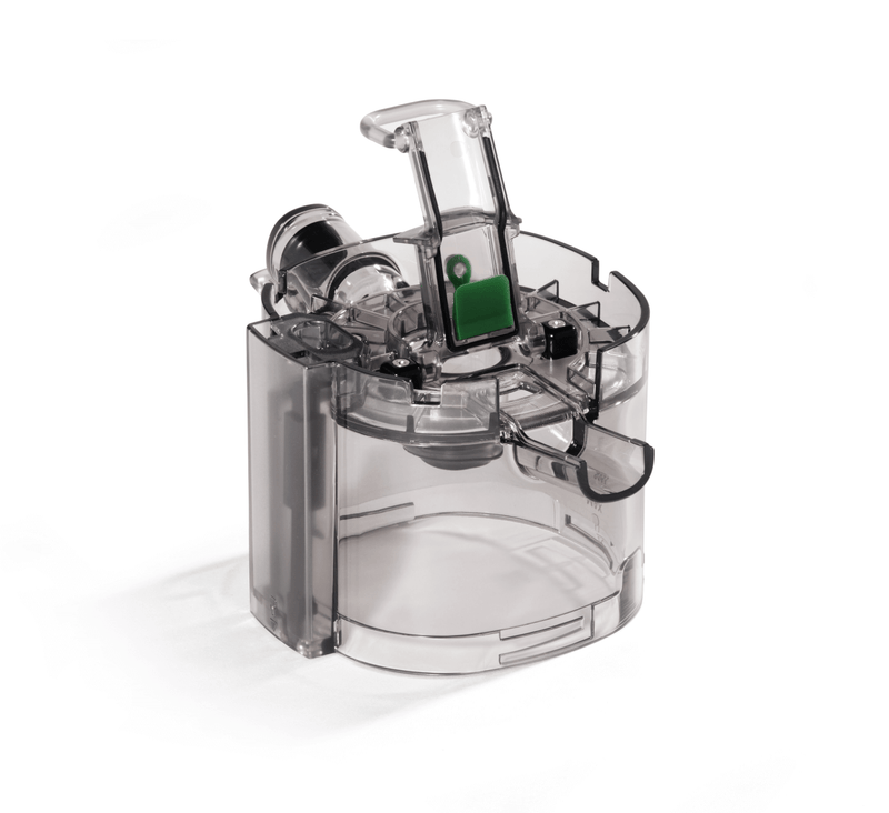 A transparent plastic Pulp Outlet Gasket medical device featuring a flip-top lid, a green rectangular button, and various internal mechanisms inspired by Nama J3 Cold Press Juicer technology, displayed on a white background.