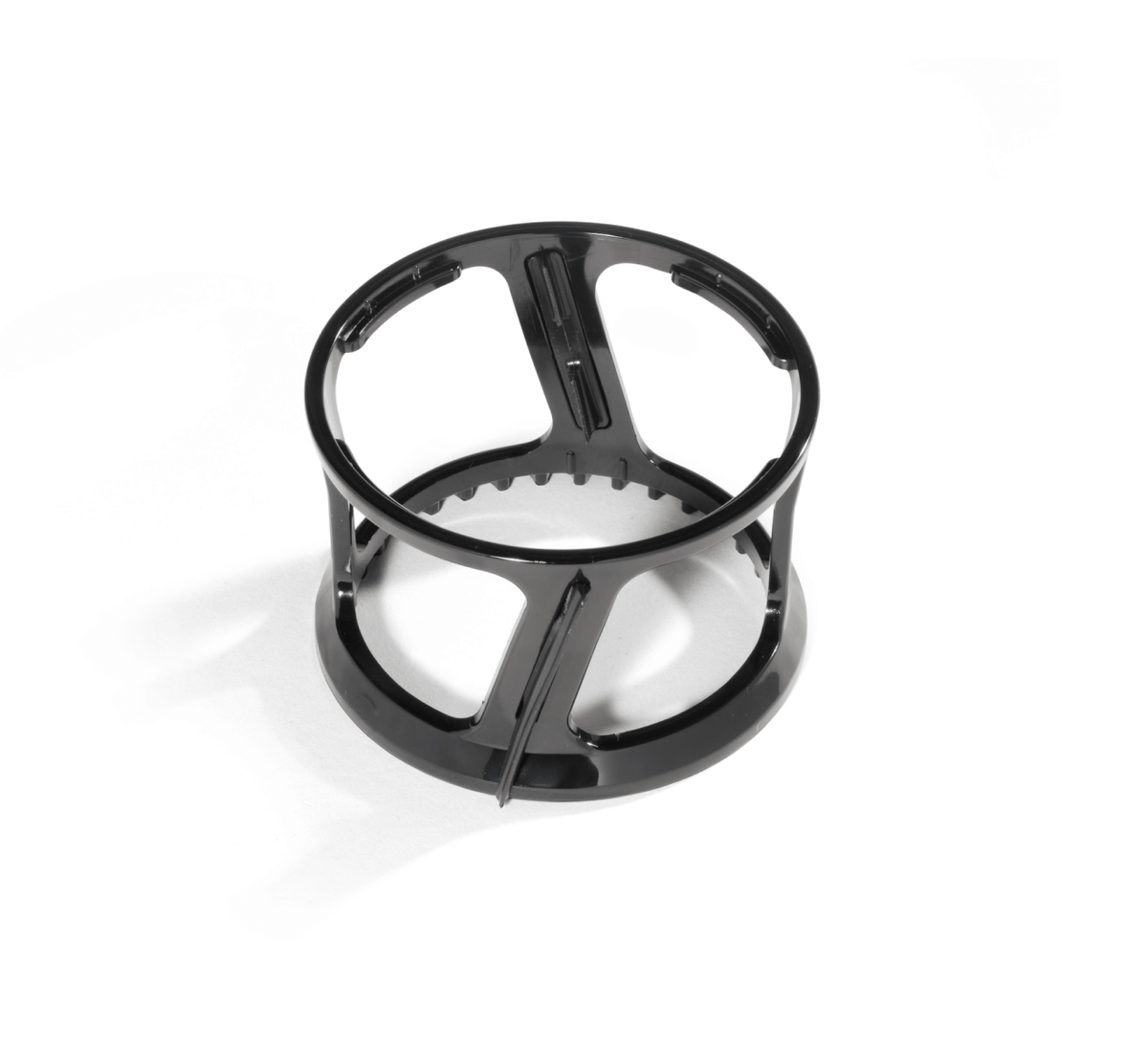 A black plastic circular holder with open sides and vertical supports, designed to hold components such as the Spinning Brush, placed on a white background.