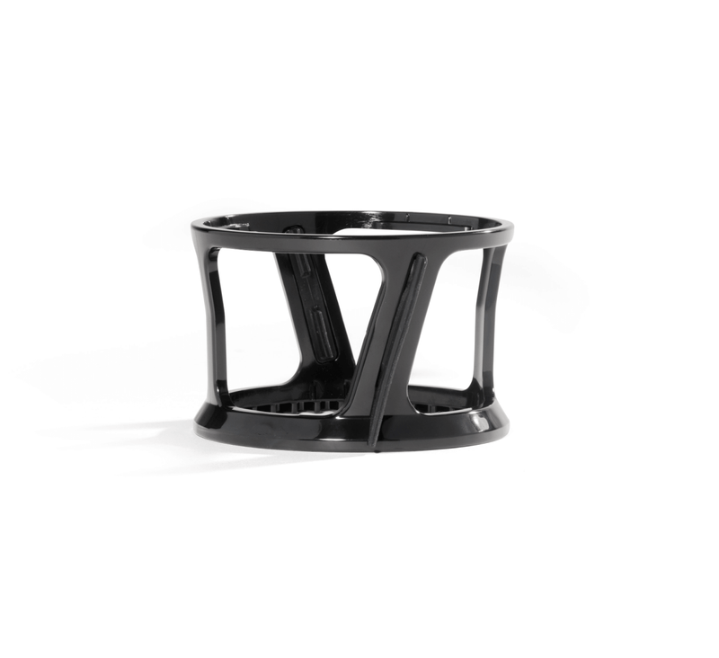 A black, cylindrical plastic stand with open sides and a sturdy base, designed to hold the Spinning Brush, photographed on a white background.