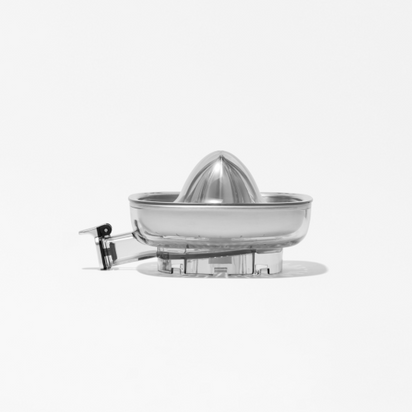 The Citrus Attachment, a metallic juicer with a conical top and handle on a transparent base, is ready to deliver fresh citrus juice against a plain white background.
