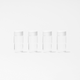 Four identical Glass Bottle Set 17-ounce bottles with white caps are evenly lined up against a plain white background, perfect for storing juice.